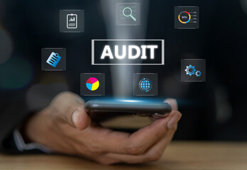 Business audit concept, businessman holding smartphone with business audits, financial reviews and...