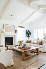 Fototapeta premium A living room with a fireplace, a coffee table, and a couch