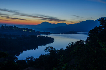 Colorful serene tranquil and peaceful landscape during sunrise, Bhandardara, Maharashtra, India.