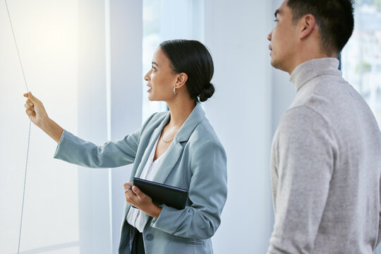 Woman, man and consultation in house for real estate sale with investment goals and moving or relocation. Male client, realtor girl and showing property with shopping for new home and purchase deal