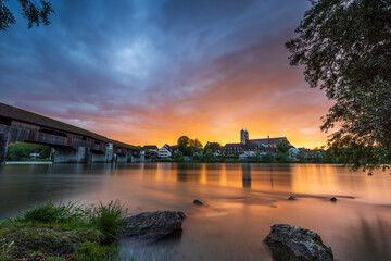 sunset over the skyline of bad säckingen germany at the river rhine with the historic wooden bridge