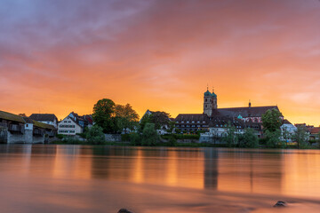 sunset over the skyline of bad säckingen germany at the river rhine with the historic saint...