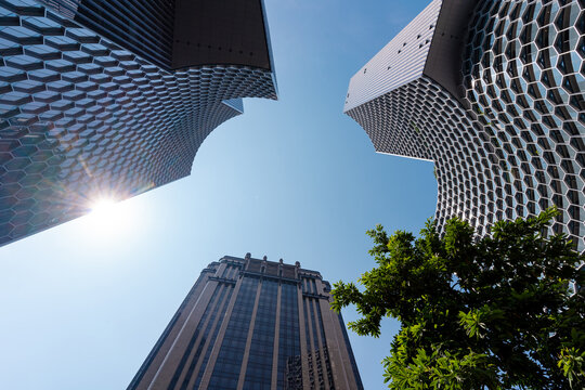 SINGAPORE - OCTOBER 08, 2023: Ground-level perspective view of contemporary skyscrapers or modern tower buildings.