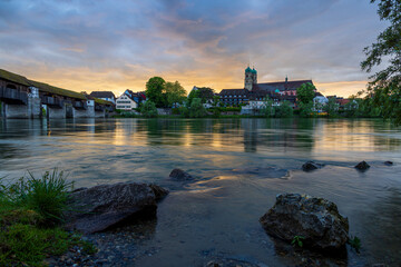 skyline of bad säckingen germany with reflection of the ancient wooden bridge and saint fridolin...