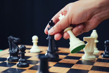 the chessboard captures the decisive moment of checkmate, symbolizing a strategic victory in a...