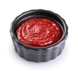 Gochujang Korean traditional spicy fermented sauce in a bowl isolated on white background. With...