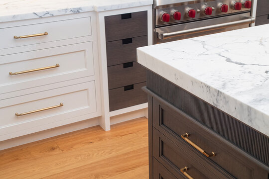 High end custom kitchen with mix of white and walnut cabinets