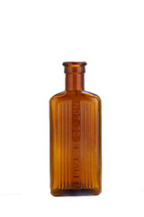 Brown vintage medicine glass ribbed bottle marked 