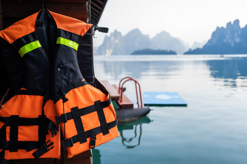 Life jackets hang outside the homestay, with beautiful mountain views in the morning.