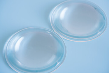 optical contact lenses on blue background