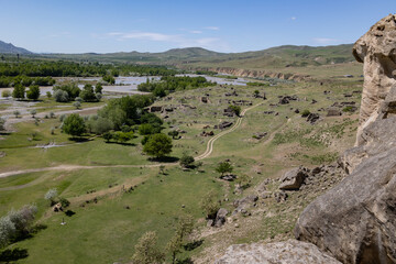 Beautiful landscape view of hills and river in Georgia near Uplistsikhe ancient cave town	
