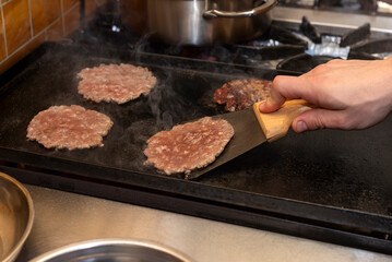 cooking, assembly and manufacturing of homemade hamburgers with ground meat and chef making the medallions step by step, the total assembly of all the ingredients