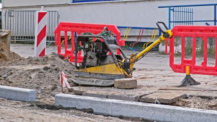 Industrial Ground Compactor Machine Parked at Roadworks Construction Site