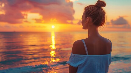 Fototapeta premium Serene Sunset View with Woman Watching the Ocean in Tranquil Moment