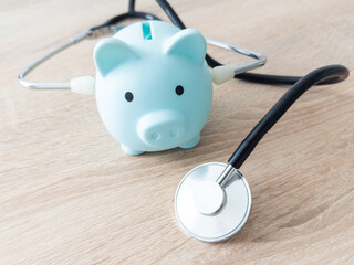 Piggy bank with medical equipment on the table medical concepts and health insurance.