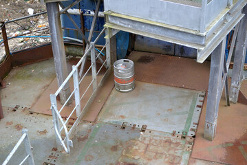Isolated Single Metal Beer Keg on Deck of Riverside Pontoon  