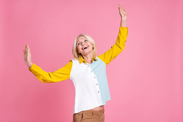 Photo of nice aged lady dancing chilling wear shirt isolated on pink color background