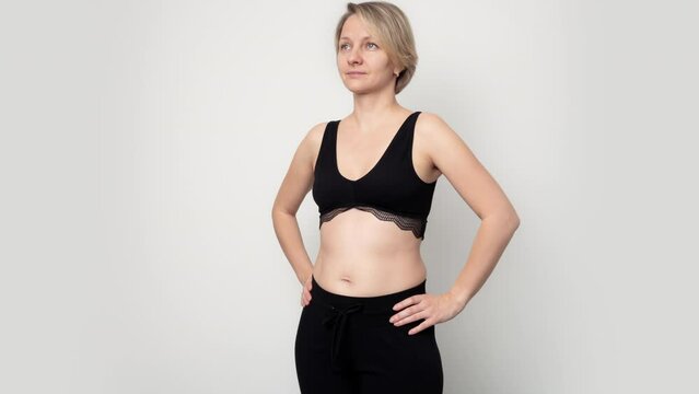4K Time Lapse of growing belly of pregnant woman, from 9 to 40 weeks, one shot per weeks, front view. Pregnancy transformation week by week.