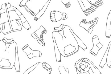 Warm autumn and winter clothes seamless pattern in doodle style. Vector collection of warm, cozy clothes and shoes. Seasonal clothing seamless pattern. Vector