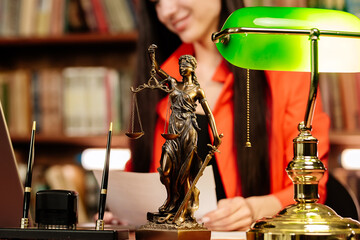 A lawyer works with contract documents together with Fimida in the courtroom. Justice and law, lawyer, judge, concept.