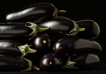 eggplants on black background