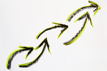 Bright neon, green and black arrows like a pigtail hand-drawn on a white background. The concept of...