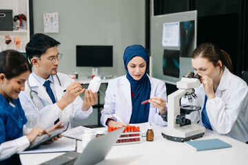 Modern Medical Research Laboratory Portrait of Team Scientists Working, Using Digital Tablet,...