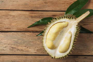 Peeled ripe durian on a wooden table