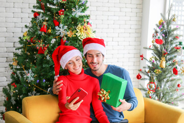 Couples are selfie together handsome man have green gift box in his hand, happy new year and...