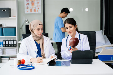 Obraz premium Doctors analyzing results or diagnosis of patient in clinic. Teamwork, medical and healthcare workers in discussion and research on desk in hospital
