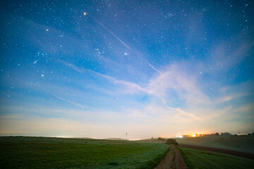 panorama of a rural night landscape with a view of the stars
