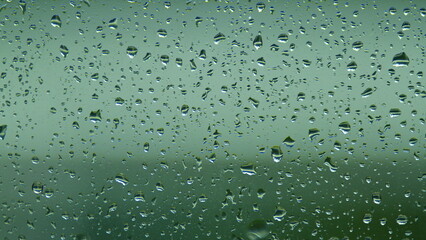 Water Drops On Glass Background. Reflected Light. Pan.