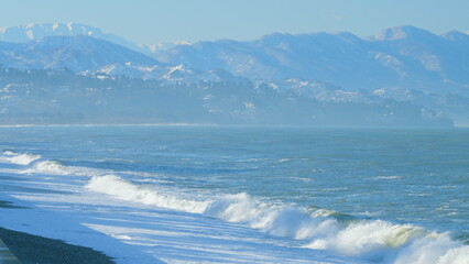 Foam Waves On The Beach. Beach Against The Mountains And The Sky On A Sunny Summer Morning. Real...