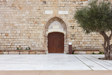 Fototapeta premium Sant Marti de Empuries medieval church facade. Costa Brava, Spain