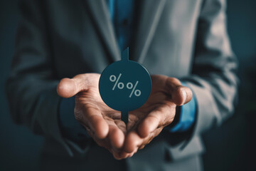 Businessman holds up an arrow icon and percentage with graph indicators for investment growth.