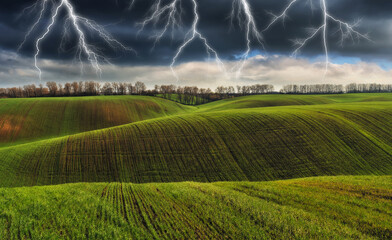 thunderstorm in the field. huge lightning over a hilly field. bad weather in the field. Nature of...