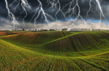 thunderstorm in the field. huge lightning over a hilly field. bad weather in the field. Nature of...