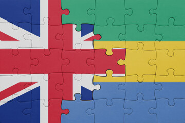 puzzle with the colourful national flag of gabon and flag of great britain.