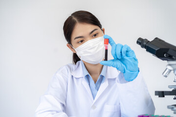 Young female scientist with blood vessel sample in the lab