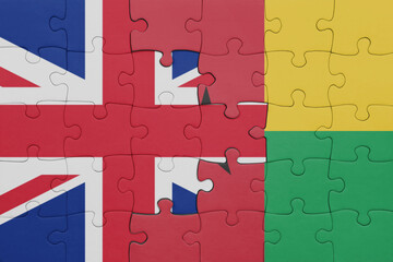 puzzle with the colourful national flag of guinea bissau and flag of great britain.