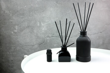 luxury aroma scent reed diffuser glass bottle are on white steel table to creat romantic and relax...