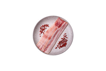 Delicious bacon in the form of slices with salt, spices and herbs