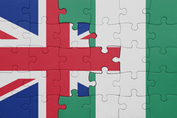 puzzle with the colourful national flag of nigeria and flag of great britain.