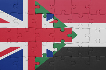 puzzle with the colourful national flag of sudan and flag of great britain.