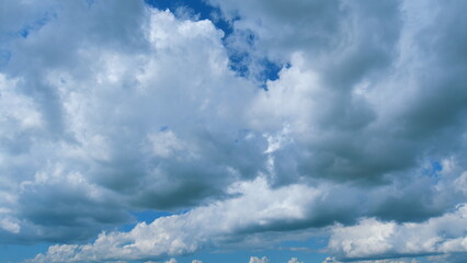 Blue Sky Background With Tiny Clouds. Low Angle View. Blue Clear Sky And White Clouds. Zoom In.