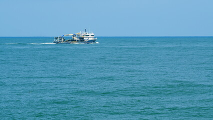 Fishing Ship Trawler At Day In The Sea. Ship Sailing Close Up Fishing Boat. Real time. © artifex.orlova