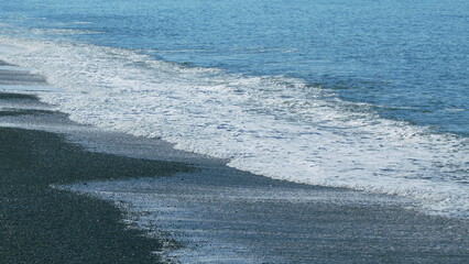 Beach Is Covered With Pebble. Small Sea Waves. Waves Crashing On A Beach. Real time.