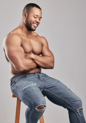 Studio, jeans and muscle of black man, strong and gym for fitness with smile, wellness and fashion....