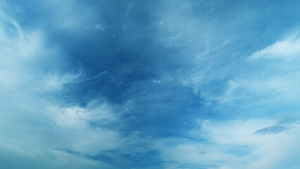 Fototapeta premium White cirrus clouds and blue colors sky. Weather was very hot in the evening. Tropical summer sunlight.