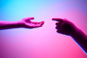 Kids hands gesturing against gradient blue purple background in neon light. Children hands reaching...